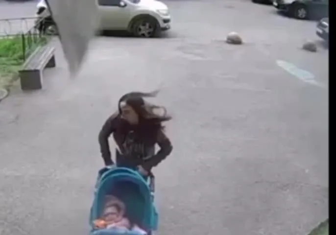 Preview for 651c7a733126a a piece of slate fell on a woman with a stroller entering th